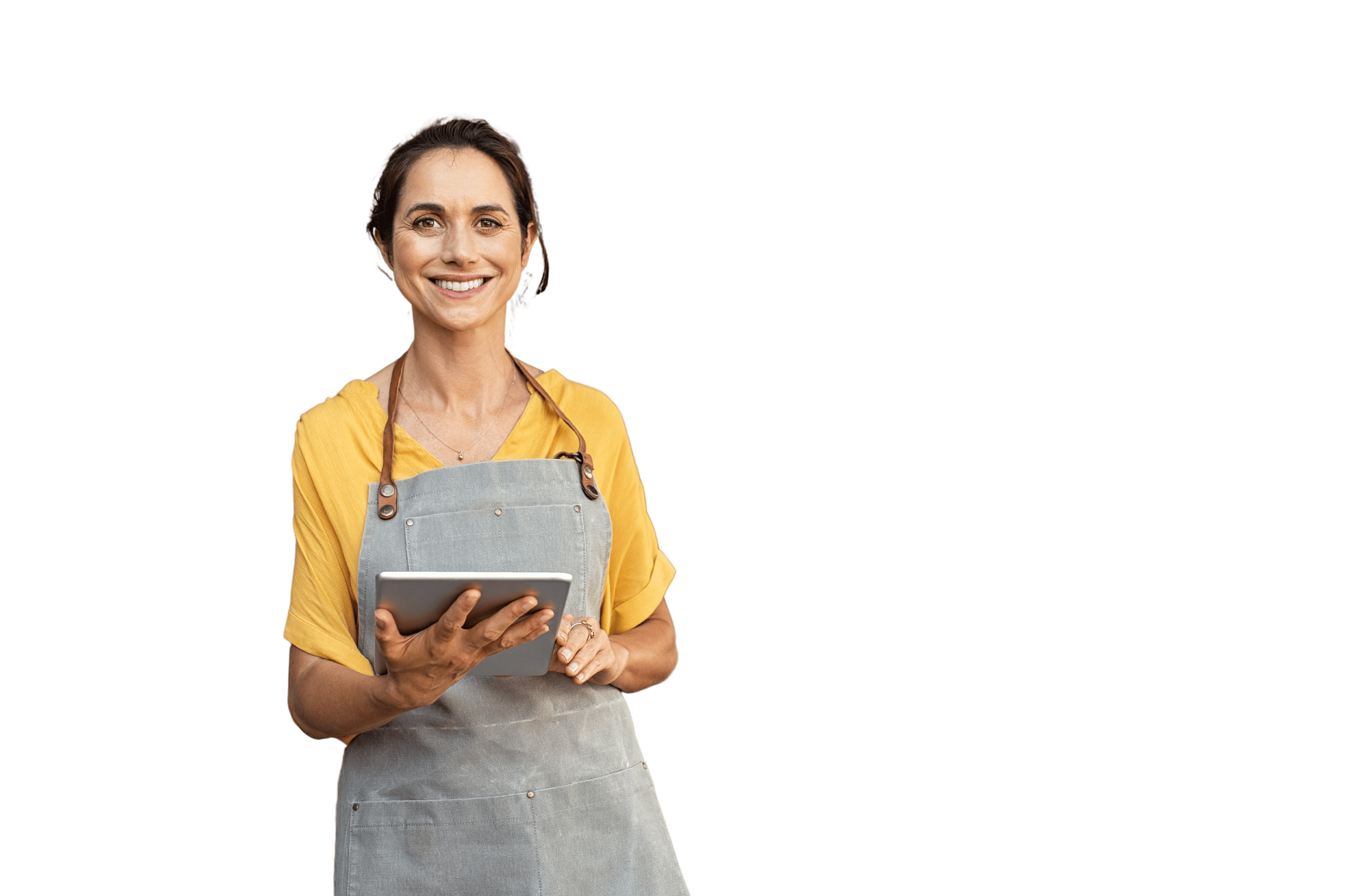 Portrait of happy woman standing at doorway of her store holding digital tablet. Cheerful mature waitress waiting for clients at coffee shop. Successful small business owner in casual clothing and grey apron standing at entrance and looking at camera.